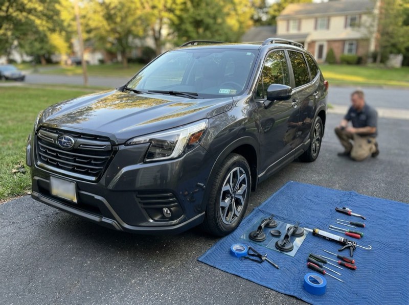 Mobile auto glass service set up in a Reading, PA driveway with technician tools laid out